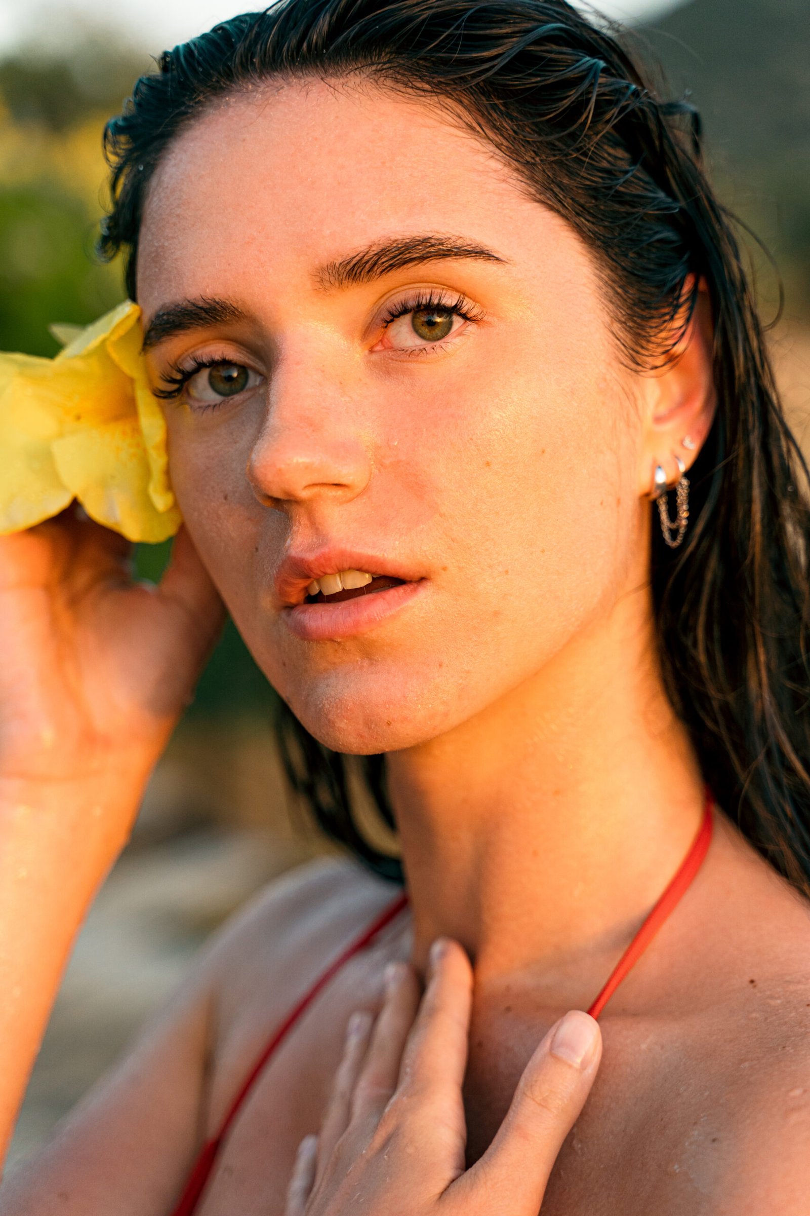Beauty portrait of young girl with yellow flower after spa procedure